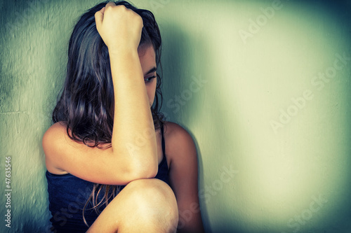 Photo: Bleached vintage portrait of a sad and lonely teenager Bleached vintage portrait of a sad and lonely teenager