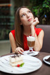 Attractive young woman has a rest in restaurant
