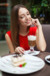 Attractive young woman has a rest in restaurant