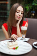 Attractive young woman has a rest in restaurant