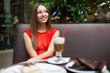 Attractive young woman has a rest in restaurant