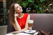 Attractive young woman has a rest in restaurant