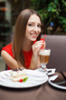 Attractive young woman has a rest in restaurant