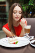 Attractive young woman has a rest in restaurant