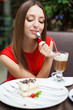Attractive young woman has a rest in restaurant