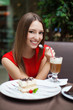 Attractive young woman has a rest in restaurant
