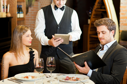 Photo: Couple having dinner in a luxury restaurant Couple having dinner in a luxury restaurant