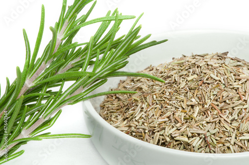 Photo: Fresh rosemary and a bowl with dried Fresh rosemary and a bowl with dried