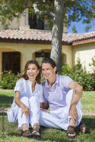 Photo: Happy Middle Aged Man Woman Couple Sitting Outside Happy Middle Aged Man Woman Couple Sitting Outside
