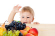Photo: Baby with pile of fruit Baby with pile of fruit
