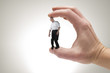 Concept picture of studio man between fingers