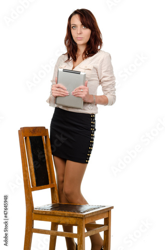 Photo: Young woman holding a tablet Young woman holding a tablet