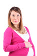Happy pregnant woman holds her belly and looks at camera