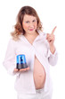 Pregnant woman in white holds blue flasher