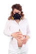 Pregnant woman in white and respirator holds belly isolated