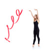 Photo: Beautiful ballerina in black suit with red ribbon stands Beautiful ballerina in black suit with red ribbon stands
