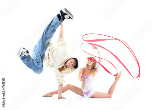 Photo: Young breakdancer stands on one hand and leg held up Young breakdancer stands on one hand and leg held up