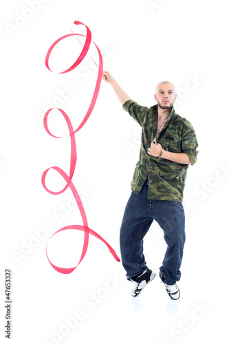 Photo: Rapper in camouflage jacket with ribbon stands on tiptoes Rapper in camouflage jacket with ribbon stands on tiptoes