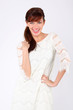 Beautiful young woman wearing in white openwork dress laughs.
