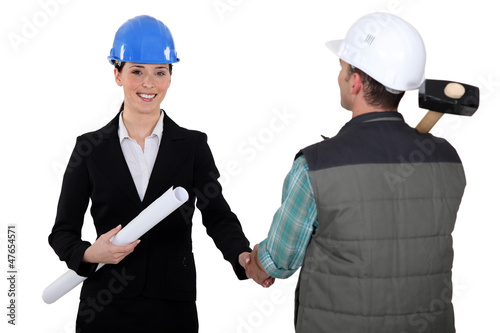 Photo: Architect shaking builders hand Architect shaking builders hand