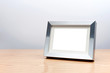 Blank silver picture frame on the table with clipping path