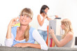 Three young women making calls