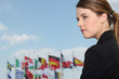 Woman with flags in the background