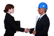 Two architects shaking hands