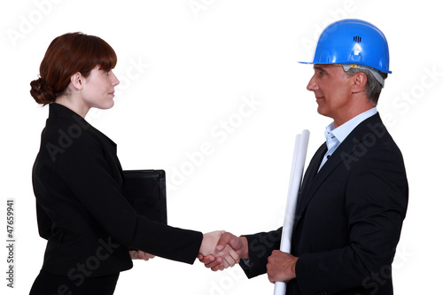 Photo: Two architects shaking hands Two architects shaking hands