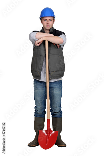 Photo: Man stood with shovel Man stood with shovel