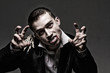 Dark dramatic portrait of a young vampire