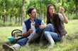 Couple of winegrowers with glasses of wine