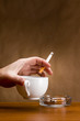 Photo: Hand holding a cigarette Hand holding a cigarette