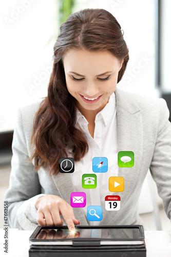 Photo: happy woman with tablet pc computer happy woman with tablet pc computer