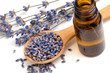 Photo: Dried lavender with a bottle of essential oil over white Dried lavender with a bottle of essential oil over white
