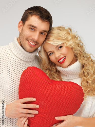 Photo: family couple in a sweaters with heart family couple in a sweaters with heart