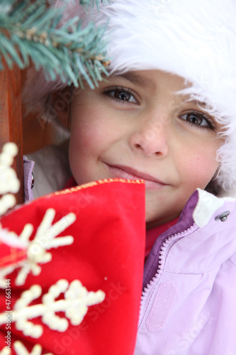 Photo: Young girl outside a winter cabin Young girl outside a winter cabin