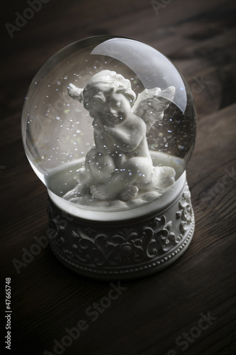 Photo: snow globe with snow flakes and angel snow globe with snow flakes and angel