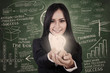 Businesswoman give light bulb in class