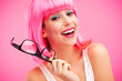 Woman with pink wig and glasses