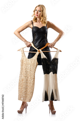 Photo: Young attractive woman trying new dresses Young attractive woman trying new dresses