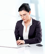 Business woman working with her laptop