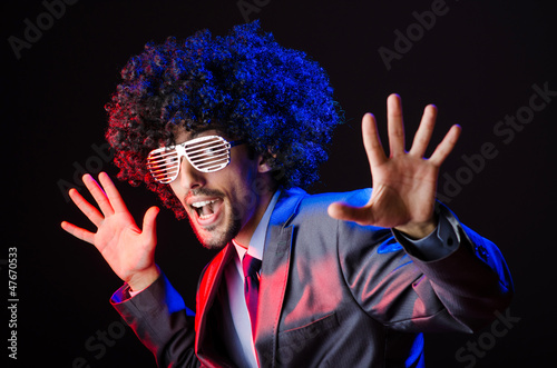 Photo: Singer with afro cut in dark studio Singer with afro cut in dark studio