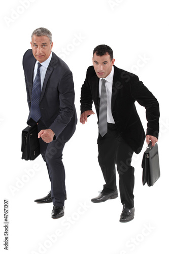 Photo: Two businessmen racing each other Two businessmen racing each other