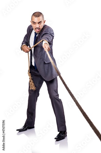 Photo: Man pulling the rope on white Man pulling the rope on white