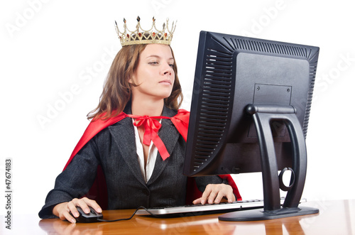 Photo: Superwoman worker with crown working in office Superwoman worker with crown working in office