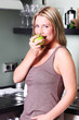 Young Woman Eating an Apple