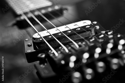 Fototapeta Strings electric guitar closeup in black tones