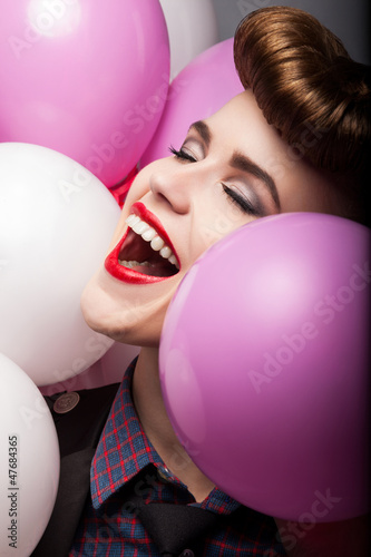 Photo: Elation. Happy Laughing Girl with Colorful Air Balloons - Sales Elation. Happy Laughing Girl with Colorful Air Balloons - Sales