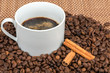 Black coffee, beans and cinnamon